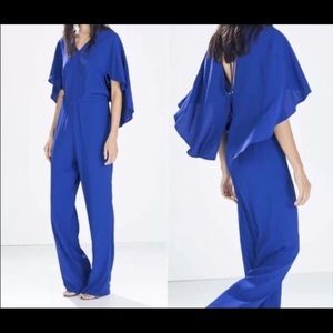 Zara blue jumpsuit with open back and cape